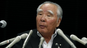 Suzuki Motor Corp. then-chairman and CEO Osamu Suzuki speaks during a press conference in Tokyo, Sept. 12, 2011. (AP Photo/Shizuo Kambayashi)