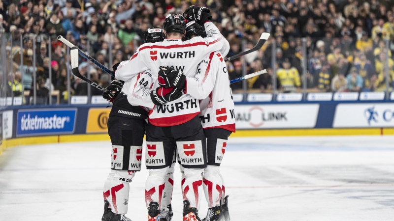 Team Canada's Jonathan Hazen, left, and Team Canada's Logan Shaw, center, celebrate during the game between Switzerland's HC Davos and Team Canada at the 96th Spengler Cup ice hockey tournament in Davos, Switzerland, Thursday, Dec. 26, 2024. (Source: Til Buergy/Keystone via AP)