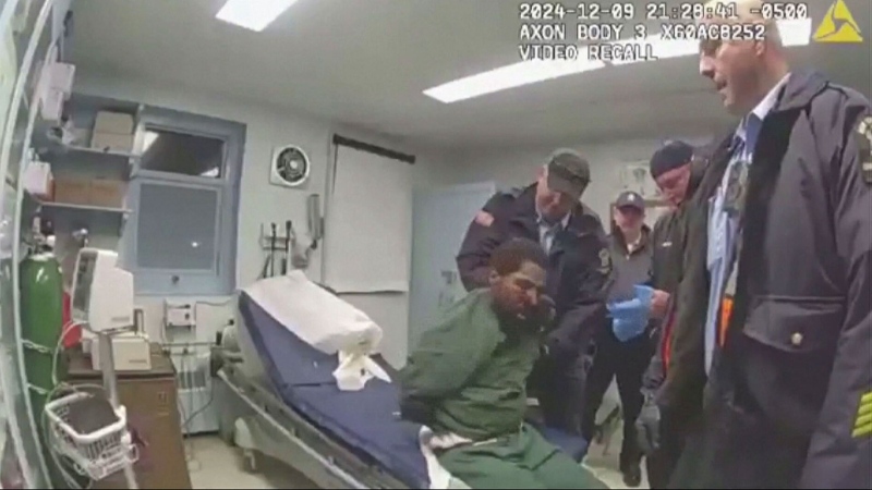 Footage shows cuffed inmate being assaulted