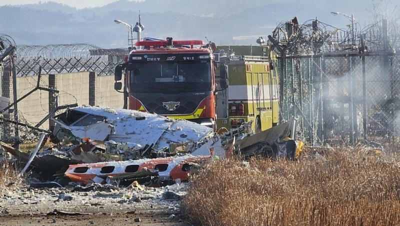 Fire engines work to extinguish a fire at the Muan International Airport in Muan, South Korea, Sunday, Dec. 29, 2024. (Maeng Dae-hwan/Newsis via AP)