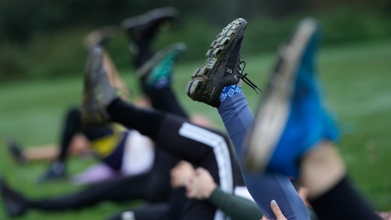 Participants takes part in an outdoor gym class led by personal fitness trainer Richard Lamb, during an outdoor gym class in London, Saturday, Oct. 26, 2024. (AP Photo/Alastair Grant)