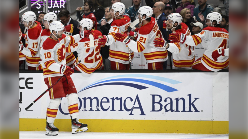 Calgary Flames centre Jonathan Huberdeau (10) celebrates after his goal against the San Jose Sharks during the first period of an NHL hockey game Saturday, Dec. 28, 2024, in San Jose, Calif. (AP Photo/Eakin Howard)