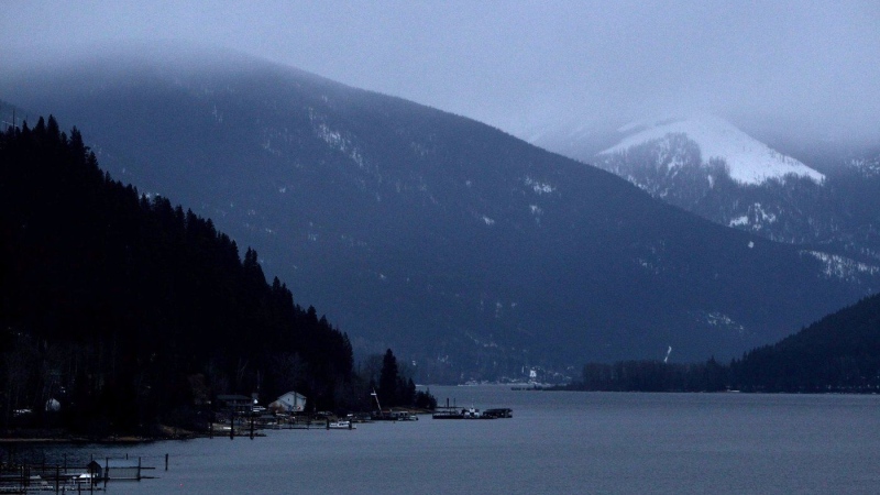 Kokanee Glacier, right, is pictured shrouded by low cloud above Kootenay Lake north of Nelson, B.C., on Monday, Jan. 17, 2011. (THE CANADIAN PRESS/Darryl Dyck)