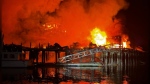 The Alert Bay Fire Department posted this image of a devastating fire that engulfed the boardwalk in Telegraph Cove, B.C., on Dec. 31, 2024. 