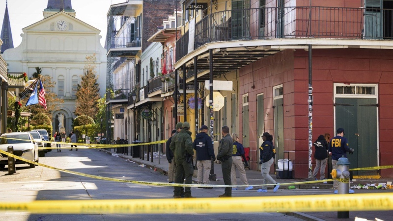 The FBI investigates the area where a suspicious package was detonated in New Orleans on Wednesday, Jan. 1, 2025. (AP Photo/Matthew Hinton)