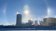 Sun dogs and building exhaust hang over downtown Regina on a cold Friday afternoon. (GarethDillistone/CTVNews) 