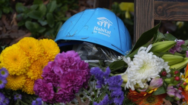 A Habitat for Humanity hard hat is among the items left in tribute to former President Jimmy Carter at the entrance to the Jimmy Carter Presidential Center Tuesday, Dec. 31, 2024, in Atlanta. Carter died Sunday at the age of 100. (AP Photo/John Bazemore )