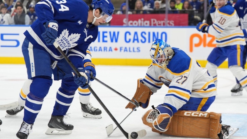 Maple Leafs centre Auston Matthews (34) is stopped by Buffalo Sabres goaltender Devon Levi during second-period NHL action in Toronto on Sunday, Dec. 15, 2024. THE CANADIAN PRESS/Frank Gunn