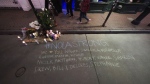 A memorial on Bourbon Street is seen at the site of a deadly truck attack on New Year's Day in New Orleans, Friday, Jan. 3, 2025. (AP Photo/Gerald Herbert)