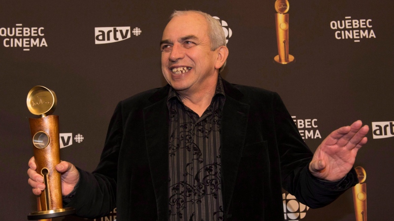 Best actor Julien Poulin poses with his trophy at the 15th annual Jutra award ceremony in Montreal on Sunday March 17, 2013. (Peter McCabe / The Canadian Press)