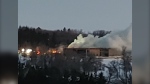 Smoke billows from the Minnewasta Golf and Country Club in Morden, Man., on Jan. 5, 2025. (Rob Rodgers)