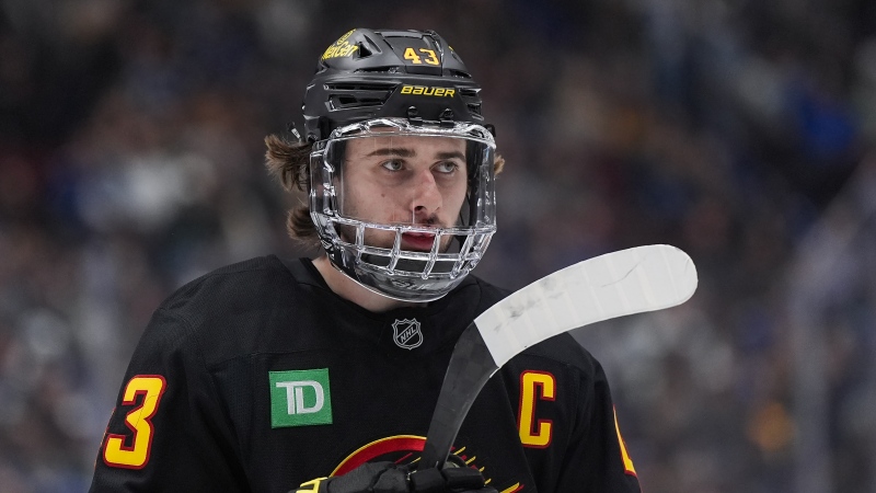 Vancouver Canucks' Quinn Hughes waits for a faceoff against the Tampa Bay Lightning during third period NHL hockey action in Vancouver, B.C., Sunday, Dec. 8, 2024. THE CANADIAN PRESS/Darryl Dyck