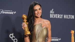 Demi Moore poses in the press room with the award for best performance by a female actor in a motion picture - musical or comedy for "The Substance" during the 82nd Golden Globes on Sunday, Jan. 5, 2025, at the Beverly Hilton in Beverly Hills, Calif. (AP Photo/Chris Pizzello)