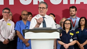 Britain's Prime Minister Keir Starmer gives a speech as he visits a healthcare provider in Surrey, England on Jan. 6, 2025, (Leon Neal / Pool Photo via AP)
