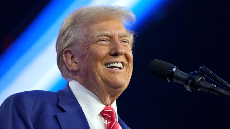 U.S. president-elect Donald Trump speaks at AmericaFest, Sunday, Dec. 22, 2024, in Phoenix. (AP Photo/Rick Scuteri)