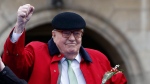 In this May 1, 2017, file photo, former far-right National Front party leader Jean-Marie Le Pen clenches his fist at the statue of Joan of Arc, in Paris. (AP Photo/Thibault Camus, File)