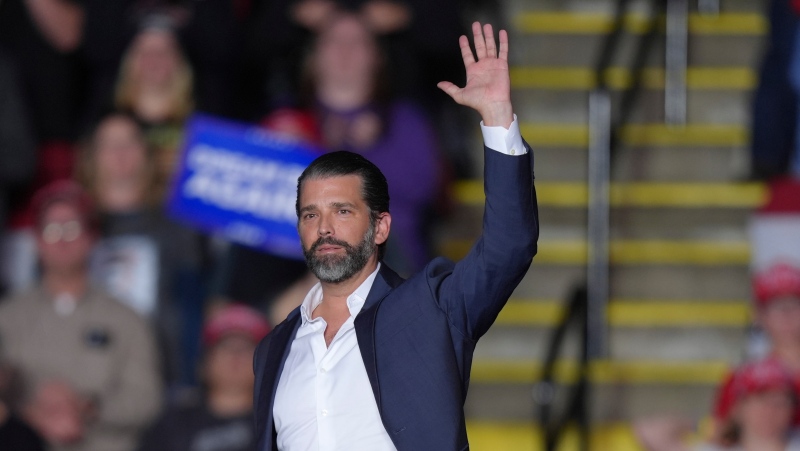 Donald Trump Jr. waves as he leaves the stage as Donald Trump speaks at a campaign rally, Nov. 4, 2024, in Reading, Pa. (AP Photo/Chris Szagola)