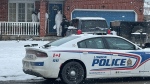 Members of the London Police Forensics Unit enter a home at the corner of Chippewa Drive and Trevor Place on Jan. 7, 2025. (Gerry Dewan/CTV News London) 