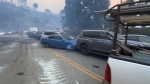 'Apocalyptic': Residents flee raging wildfires