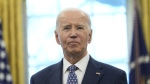 U.S. President Joe Biden pauses during a photo opportunity with Medal of Valor recipients in the Oval Office of the White House in Washington, Friday, Jan. 3, 2025. (AP Photo/Susan Walsh)
