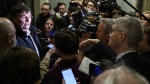 Journalists surround Minister of Finance and Intergovernmental Affairs Dominic LeBlanc before a Liberal Party caucus meeting in West Block on Parliament Hill, in Ottawa, Wednesday, Jan. 8, 2025. (Justin Tang/The Canadian Press)