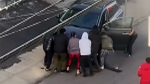 Strangers lift car to free woman pinned underneath