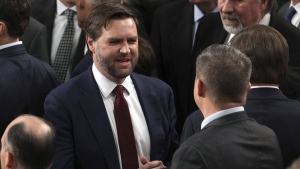 Vice President-elect JD Vance is congratulated after a joint session of Congress confirmed the Electoral College votes, affirming President-elect Donald Trump's victory in the presidential election, Monday, Jan. 6, 2025, at the U.S. Capitol in Washington. (AP Photo/Matt Rourke)