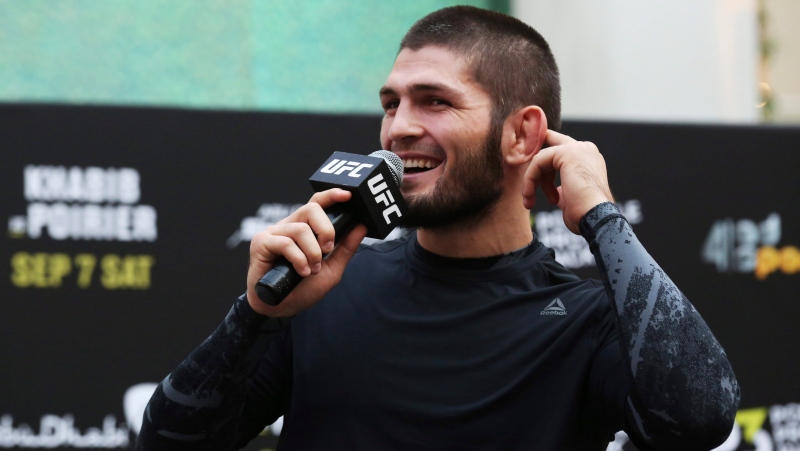 Russian UFC fighter Khabib Nurmagomedov gestures to the crowd during an open training session at Yas Mall in Abu Dhabi, United Arab Emirates, Wednesday, Sept. 4, 2019. (AP Photo/Jon Gambrell)