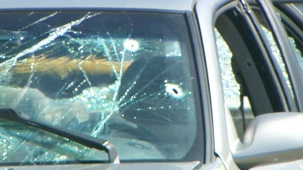 Two bullet holes visible in the windshield of a car driven by Wieslaw Duda, 50, who died in the confrontation with police on Monday, April 19, 2010.