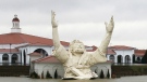 In this March 19, 2008 file photo, the "King of King's" statue of Jesus Christ stands outside of Solid Rock Church in Monroe, Ohio. The six-story-tall statue of Jesus with his arms raised along a highway was struck by lightning in a thunderstorm Monday night, June 14, 2010 and burned to the ground, police said. (AP Photo/The Journal, Nick Graham)
