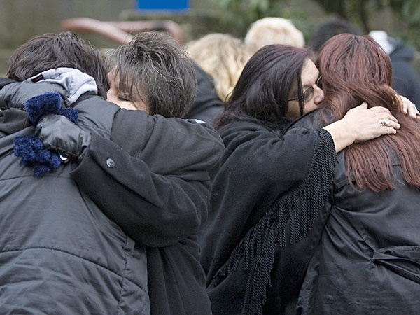Family members of some of the victims of murderer Robert Pickton hug outside the B.C. Supreme Court in New Westminster, B.C. Tuesday, December 11, 2007. (Jonathan Hayward / THE CANADIAN PRESS)