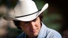 Liberal MP Justin Trudeau sports a cowboy hat while attending the party's annual Stampede breakfast in Calgary, Saturday, July 7, 2012. (Jeff McIntosh / THE CANADIAN PRESS)