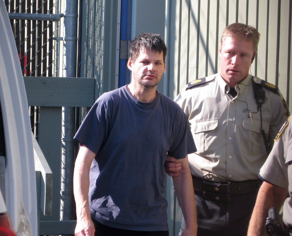 Accused child abductor Randall Hopley is led out of the Cranbrook, B.C. courthouse