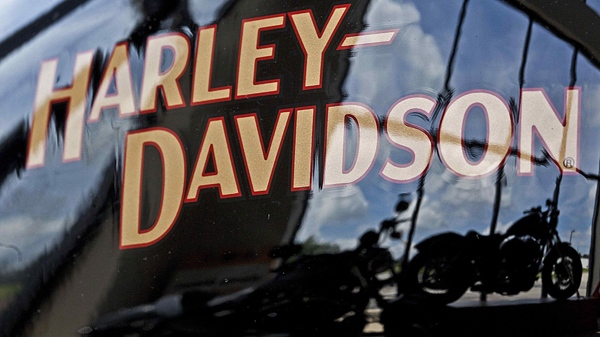 In this July 20, 2010 photo, motorcycles are reflected in a gas tank at a Harley Davidson dealer in New Berlin, Wis. (AP / Morry Gash)
