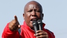 Former youth leader of the African National Congress (ANC) Julius Malema addresses mine workers at the Lonmin mine near Rustenburg, South Africa, Saturday, Aug. 18, 2012. (AP Photo/Themba Hadebe)