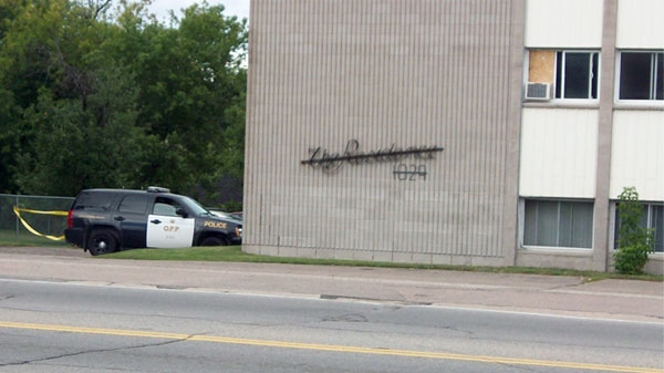 In the hours after a fatal stabbing took place in this building in Pembroke, police tape cordoned off the area, August 26, 2010.