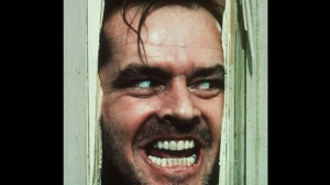 In this file image courtesy of Warner Bros. Inc., actor Jack Nicholson, portraying "Jack Torrance" in the movie "The Shining" directed by Stanley Kubrick, peers through a hole in a door.    (AP Photo/Warner Bros. Inc., FILE)