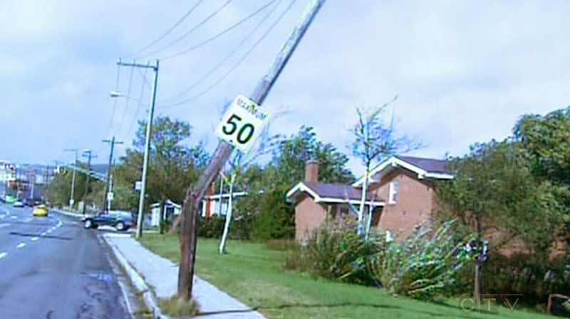 A hydro pole is damaged in St. John's, N.L., on Tuesday, Sept. 11, 2012.