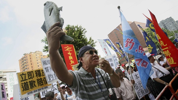 Activists demonstrate against Japan's claim over East China Sea islands outside the Japan trade office in Taipei, Taiwan, Tuesday, Sept. 14, 2010. (AP Photo/Wally Santana)